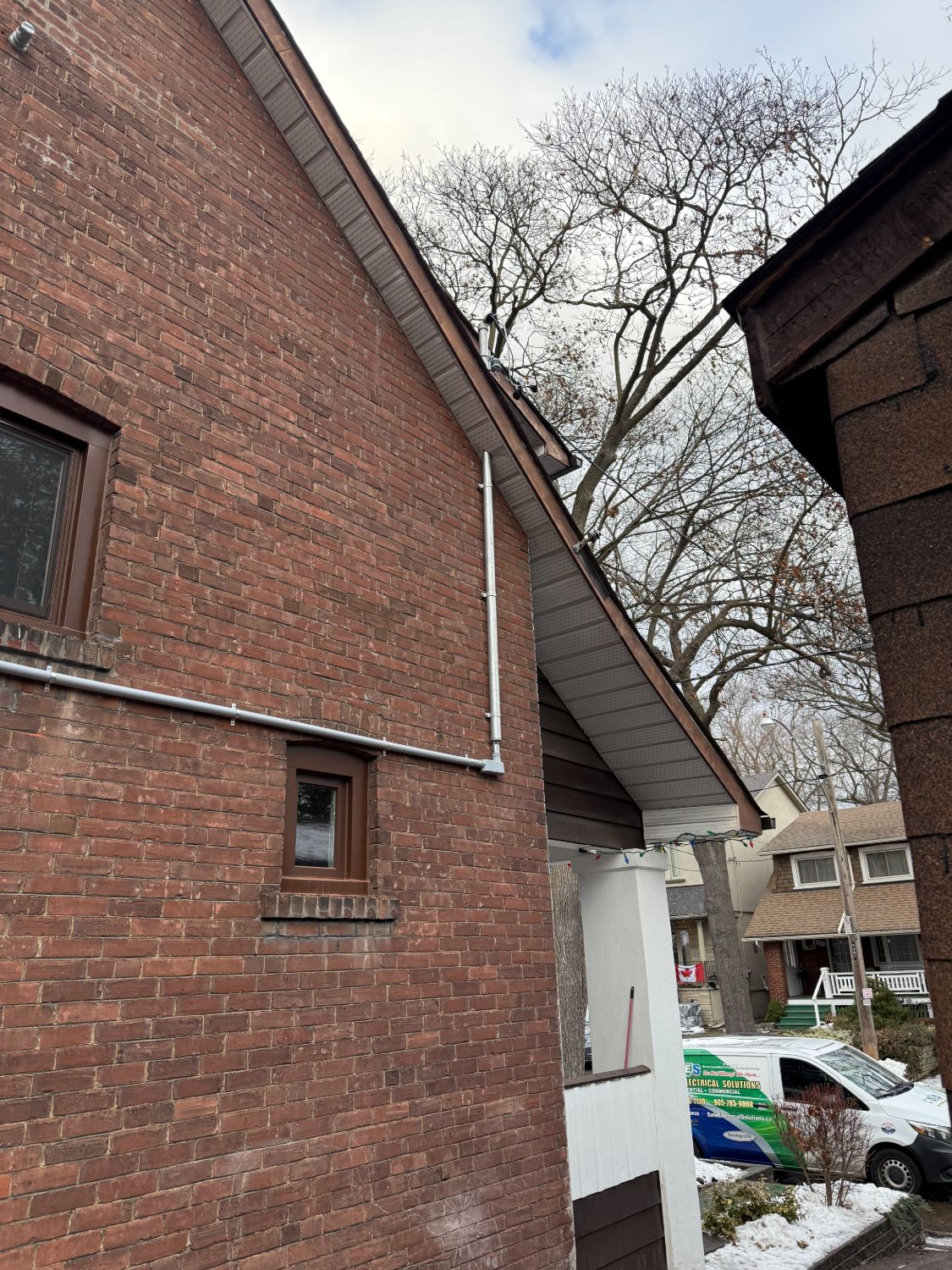 Exterior EMT conduit installation on brick home by Safe Electrical Solutions Toronto