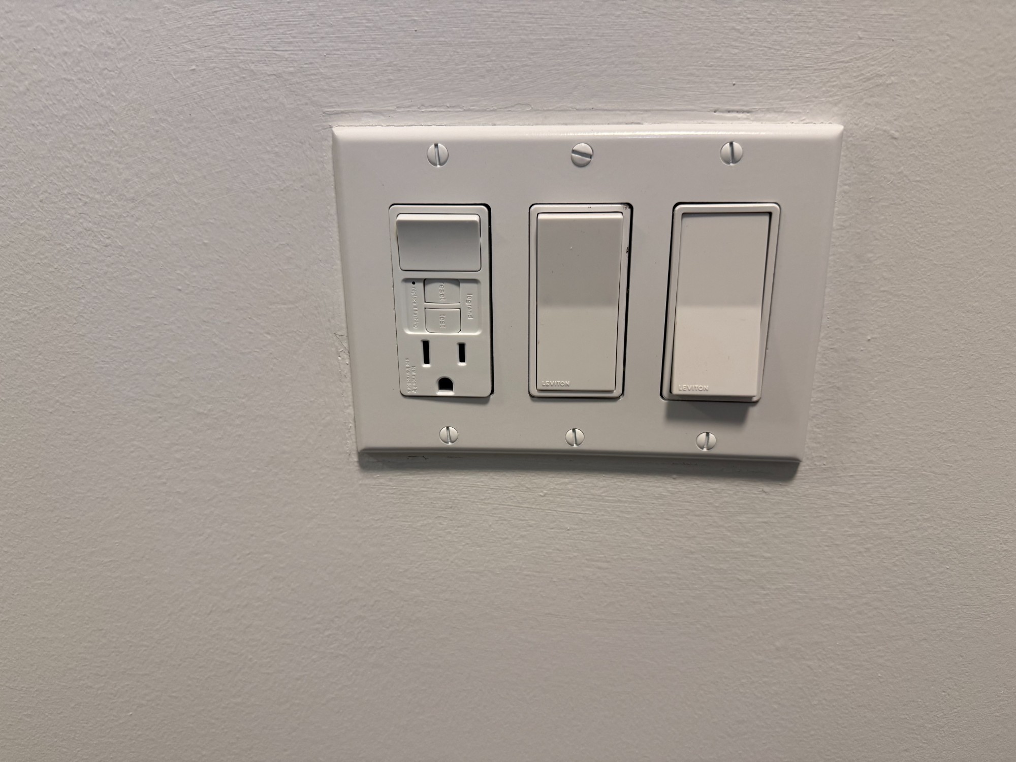 GFCI outlet and Leviton switches installed in Toronto home by Safe Electrical Solutions