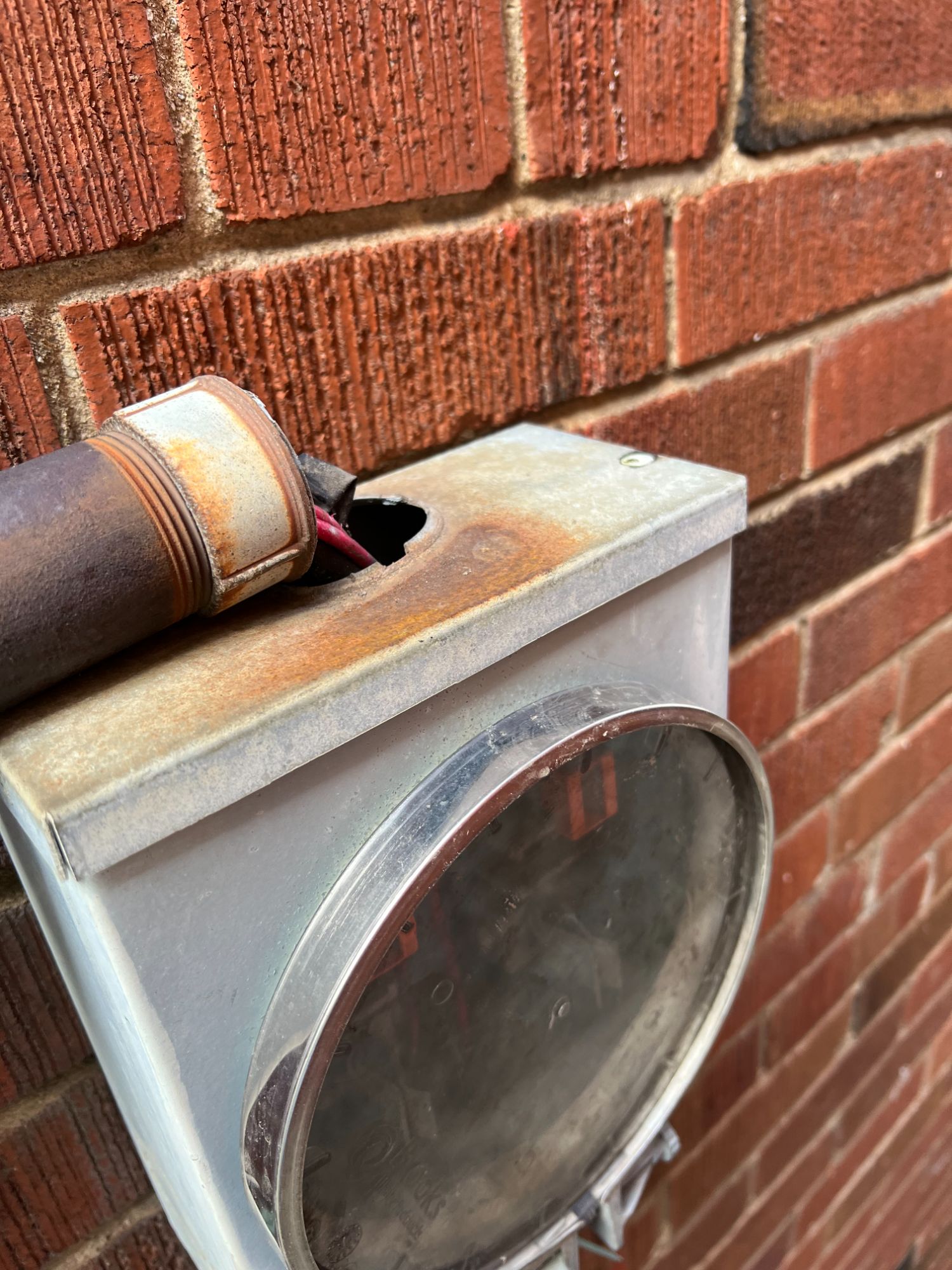 Corroded and rusted old meter socket on Toronto home showing need for immediate electrical service upgrade